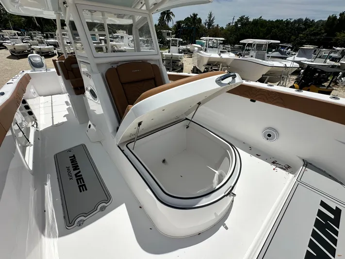  Yacht Photos Pics 2023 Twin Vee 340 GFX CC boat interior with open storage compartment.