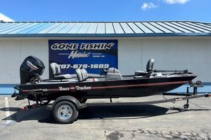 2026 Tracker Bass Tracker Classic XL boat on trailer, parked outside dealership.