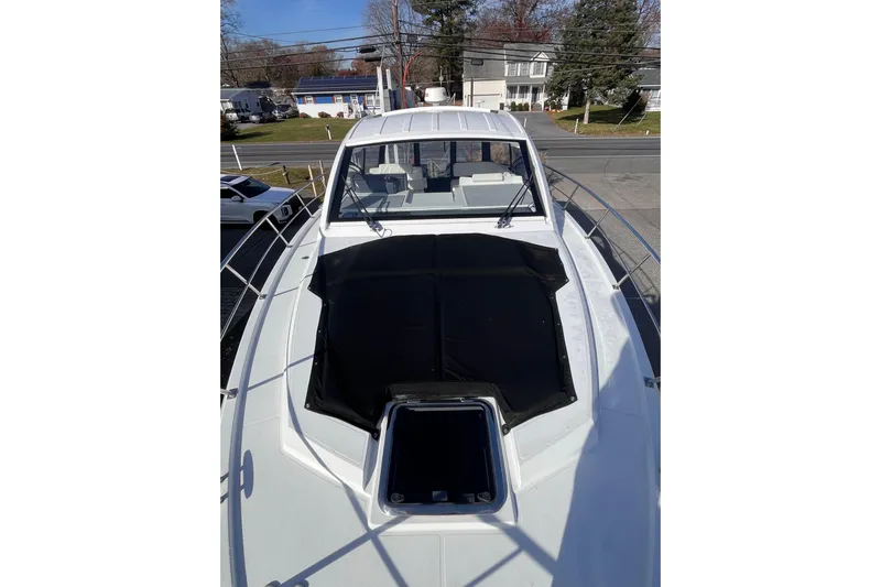  Yacht Photos Pics 2018 Cruisers Yachts 390 Express Coupe, top view, docked in a residential area.