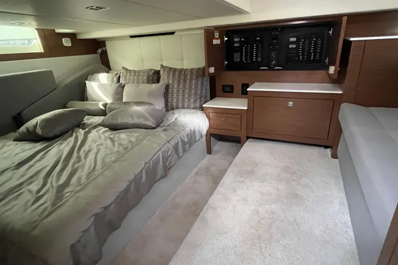  Yacht Photos Pics Luxurious cabin interior of 2018 Cruisers Yachts 390 Express Coupe with plush bedding.