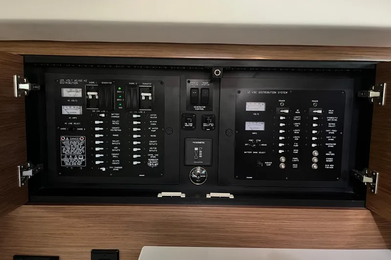  Yacht Photos Pics Electrical control panel of 2018 Cruisers Yachts 390 Express Coupe, featuring various switches and indicators.