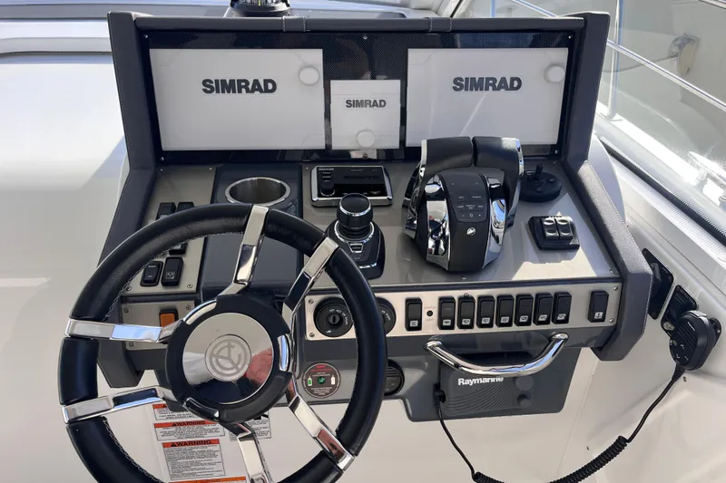  Yacht Photos Pics Helm of 2018 Cruisers Yachts 390 Express Coupe with Simrad navigation system.