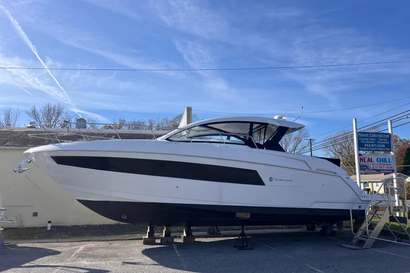  Yacht Photos Pics 2018 Cruisers Yachts 390 Express Coupe on display under clear blue sky.