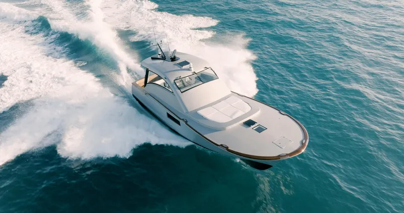  Yacht Photos Pics 2025 Buddy Davis 52 Express yacht cruising on open water.