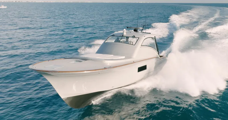  Yacht Photos Pics 2025 Buddy Davis 52 Express yacht cruising on open sea.