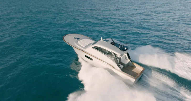  Yacht Photos Pics 2025 Buddy Davis 52 Express yacht cruising on open water.