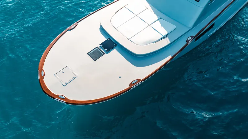  Yacht Photos Pics Buddy Davis 52 Express 2025 yacht on clear blue water, aerial view.