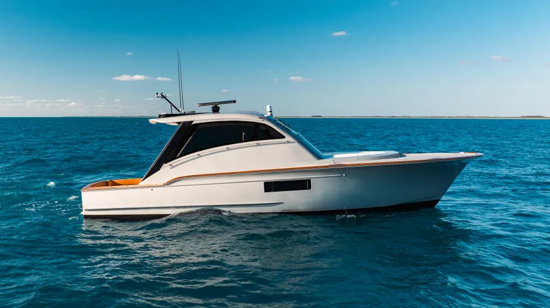  Yacht Photos Pics 2025 Buddy Davis 52 Express yacht cruising on open sea under clear blue sky.