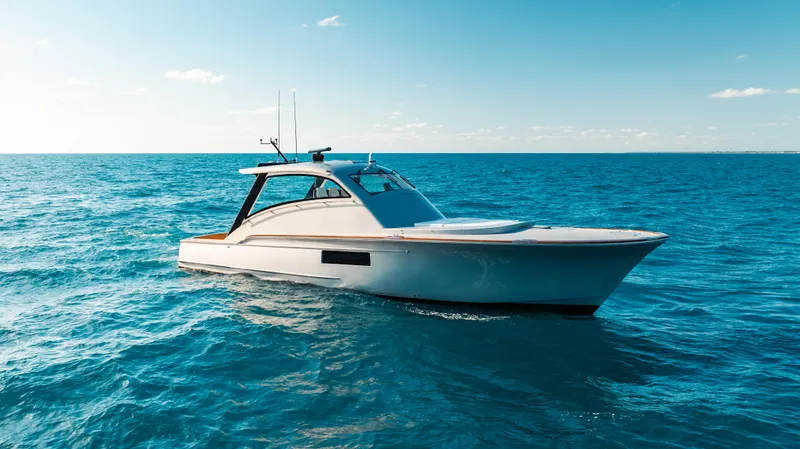  Yacht Photos Pics 2025 Buddy Davis 52 Express yacht cruising on open sea under clear sky.