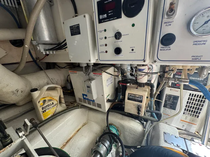  Yacht Photos Pics Engine room of 2005 Ocean Yachts 50 Super Sport with various mechanical components.