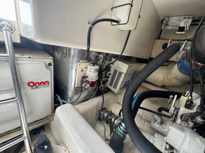  Yacht Photos Pics Engine room of 2005 Ocean Yachts 50 Super Sport with Onan generator and mechanical components.