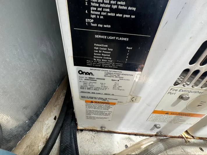  Yacht Photos Pics Engine compartment of 2005 Ocean Yachts 50 Super Sport with Onan generator labels.