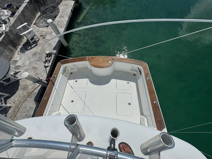  Yacht Photos Pics 2005 Ocean Yachts 50 Super Sport boat docked, viewed from above, with clear water and dockside seating.