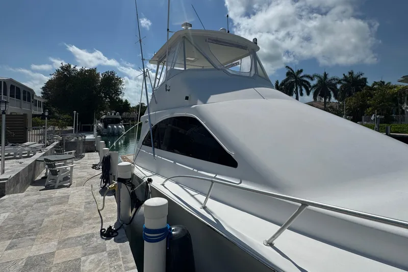  Yacht Photos Pics 2005 Ocean Yachts 50 Super Sport docked under a sunny sky.