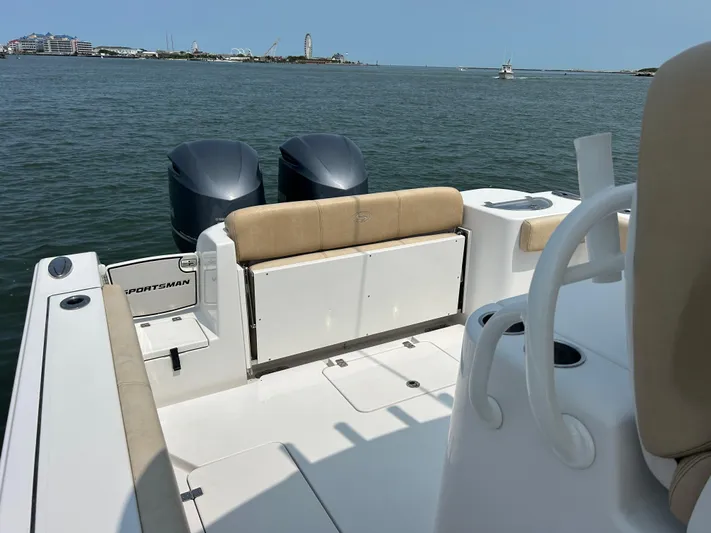  Yacht Photos Pics 2018 Sportsman Open 312 Center Console boat with dual engines on calm water.