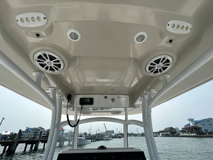  Yacht Photos Pics 2018 Sportsman Open 312 Center Console boat interior with speakers and controls.