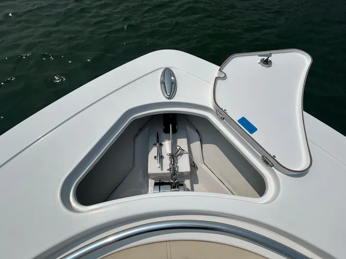  Yacht Photos Pics 2018 Sportsman Open 312 Center Console anchor compartment on calm water.