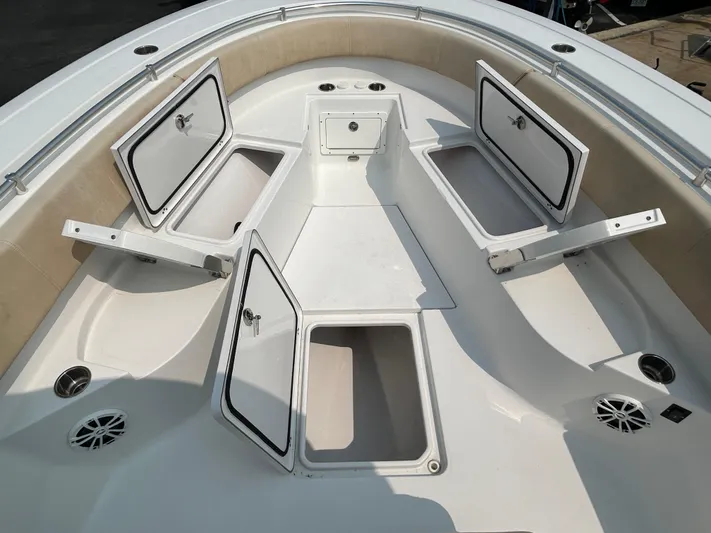  Yacht Photos Pics 2018 Sportsman Open 312 Center Console boat with open storage compartments.