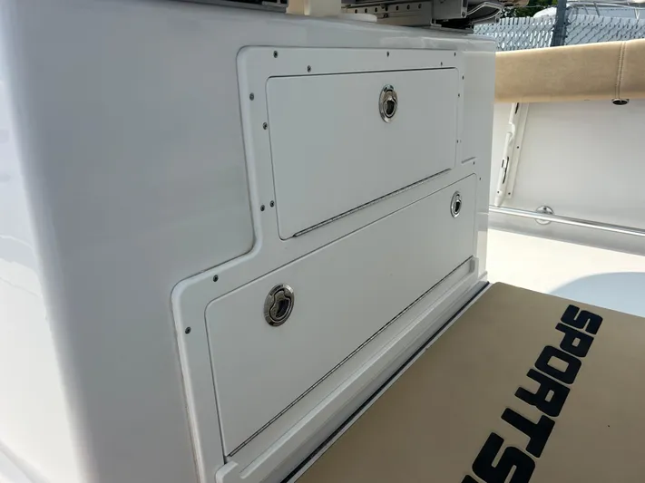  Yacht Photos Pics 2018 Sportsman Open 312 Center Console storage compartments on a boat deck.