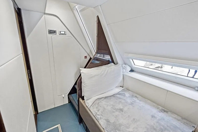 Tempus Fugit Yacht Photos Pics 2019 Sunseeker 76 Yacht interior cabin with modern design and comfortable bedding.