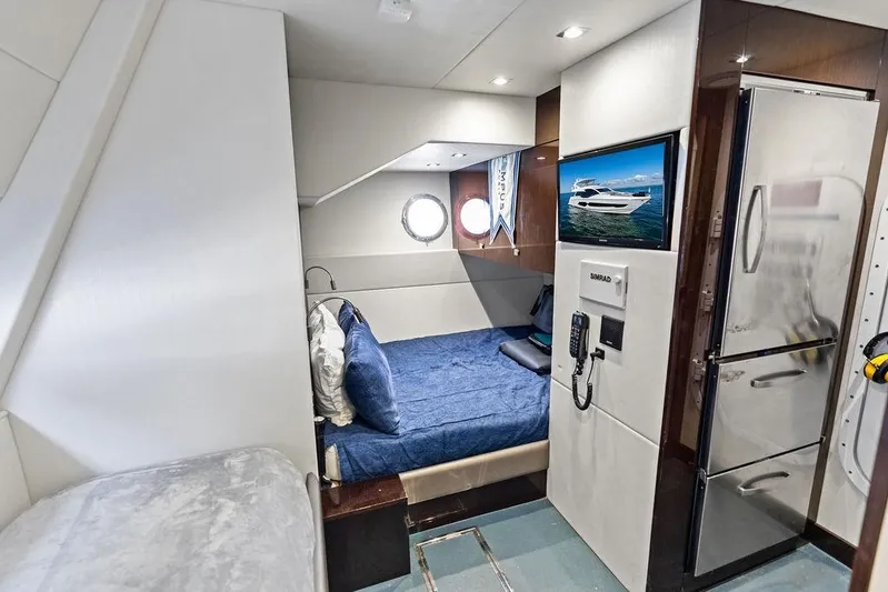 Tempus Fugit Yacht Photos Pics Luxurious interior of 2019 Sunseeker 76 Yacht with cozy bedroom and modern amenities.