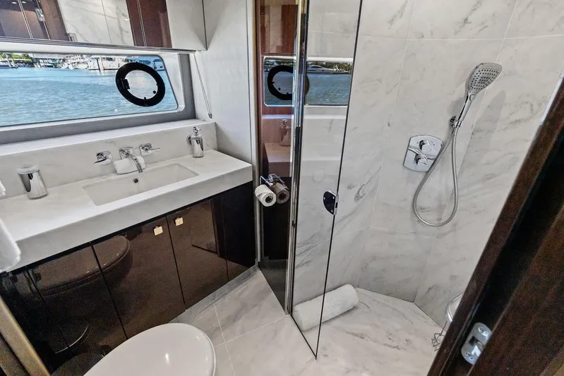Tempus Fugit Yacht Photos Pics Luxurious bathroom in 2019 Sunseeker 76 Yacht with marble shower and ocean view.