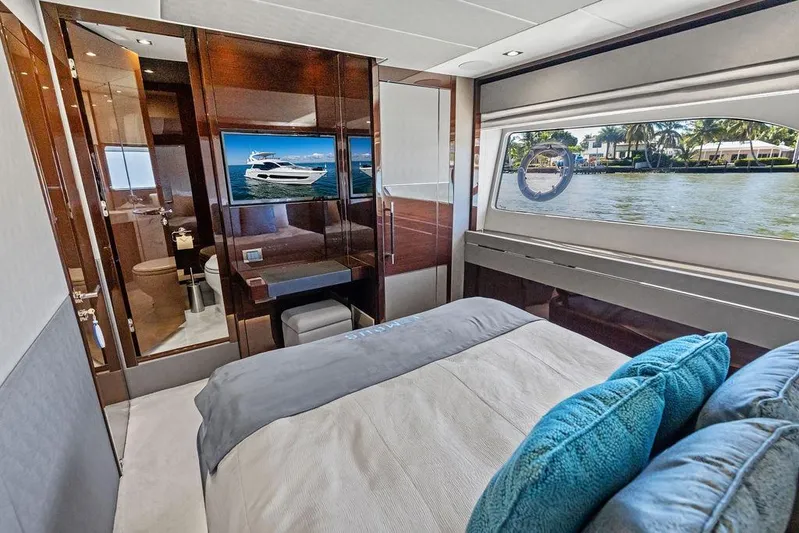 Tempus Fugit Yacht Photos Pics Luxurious 2019 Sunseeker 76 Yacht bedroom with waterfront view and modern amenities.
