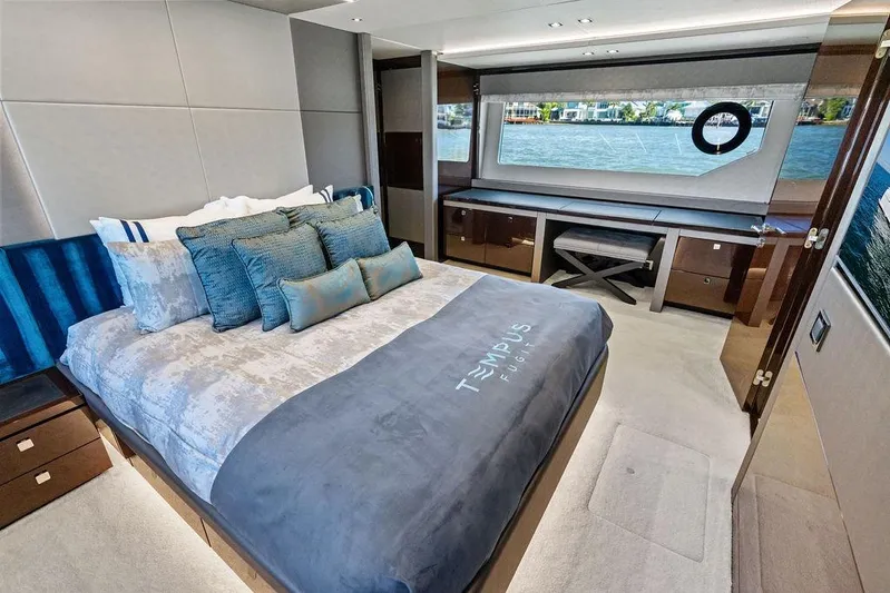 Tempus Fugit Yacht Photos Pics Luxurious bedroom interior of 2019 Sunseeker 76 Yacht with waterfront view.