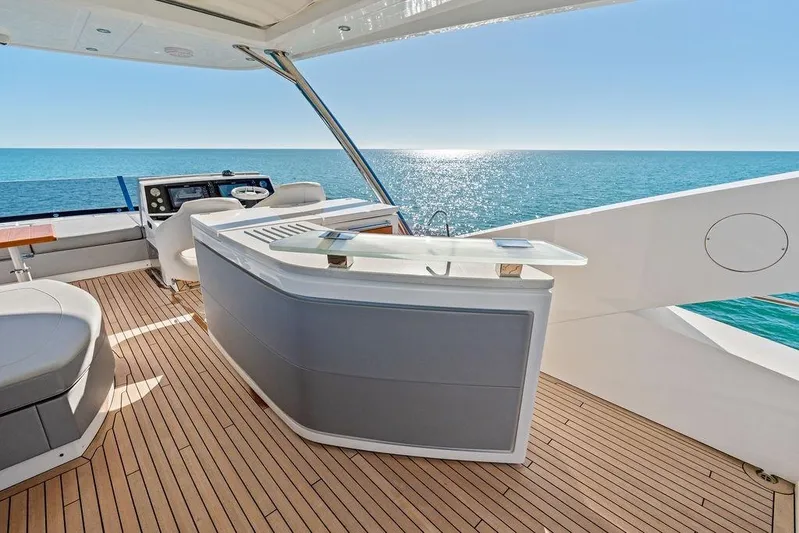 Tempus Fugit Yacht Photos Pics Luxurious 2019 Sunseeker 76 Yacht deck with ocean view and modern amenities.