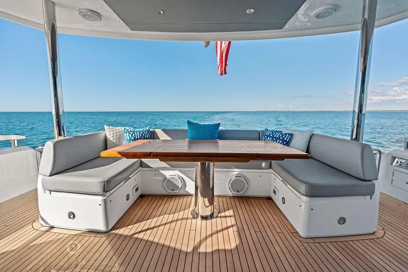 Tempus Fugit Yacht Photos Pics Luxurious 2019 Sunseeker 76 Yacht deck with elegant seating and ocean view.