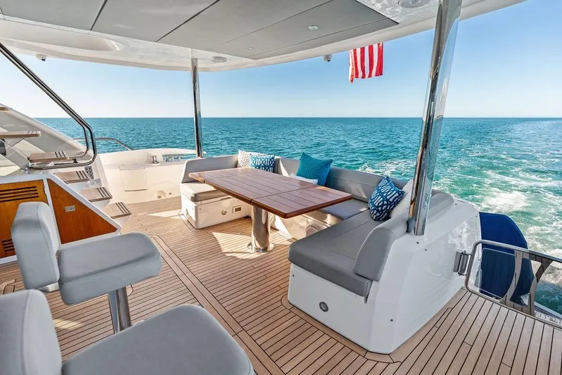 Tempus Fugit Yacht Photos Pics Luxurious 2019 Sunseeker 76 Yacht deck with ocean view and elegant seating area.