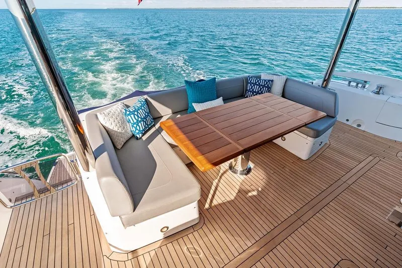 Tempus Fugit Yacht Photos Pics Luxurious 2019 Sunseeker 76 Yacht deck with elegant seating and ocean view.