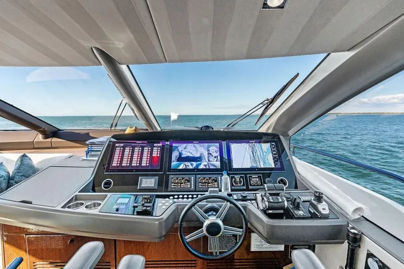 Tempus Fugit Yacht Photos Pics Cockpit view of 2019 Sunseeker 76 Yacht with advanced navigation systems.