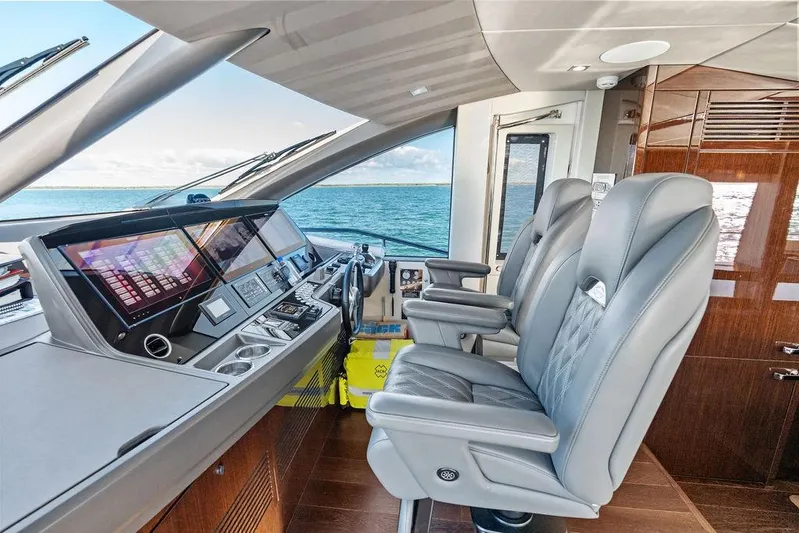 Tempus Fugit Yacht Photos Pics Luxurious 2019 Sunseeker 76 Yacht helm with modern controls and leather seating.