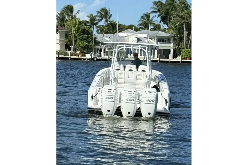 Atlas Yacht Photos Pics 2023 Contender 39 Fisharound boat with triple 400 engines on a sunny day.