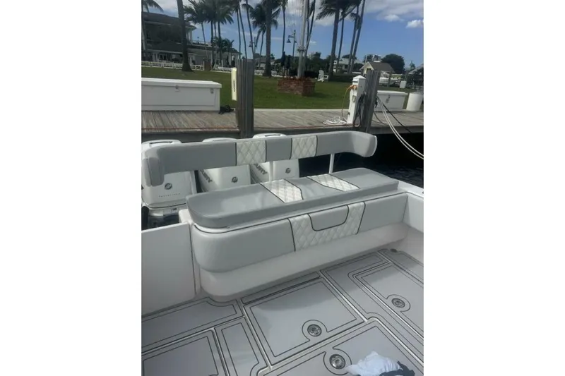Atlas Yacht Photos Pics 2023 Contender 39 Fisharound boat interior with cushioned seating and deck view.