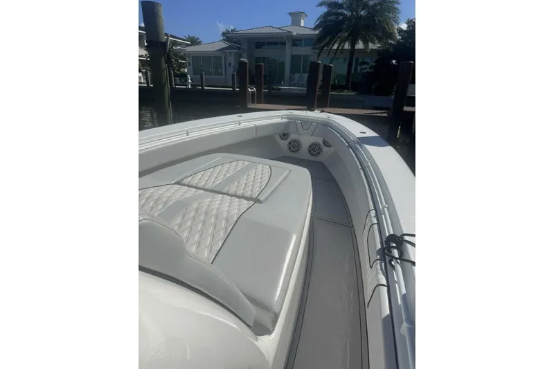 Atlas Yacht Photos Pics 2023 Contender 39 Fisharound boat with cushioned seating and sleek design.