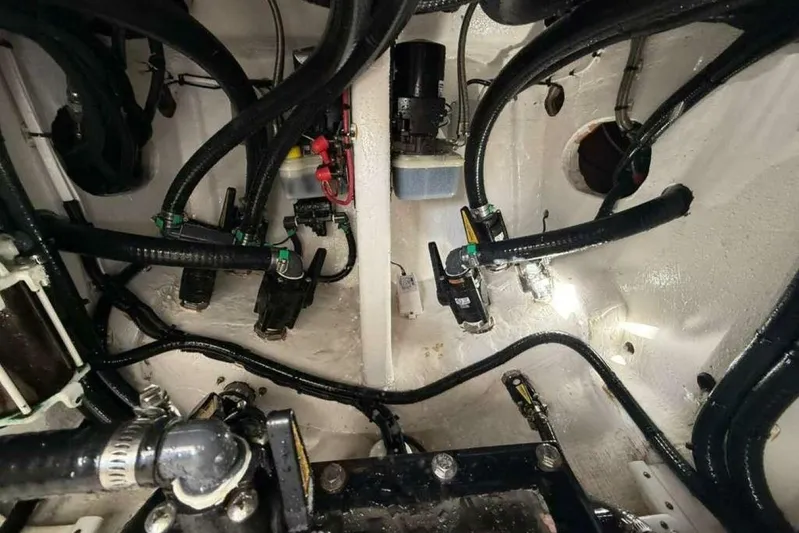 Atlas Yacht Photos Pics Engine compartment of 2023 Contender 39 Fisharound with visible wiring and components.