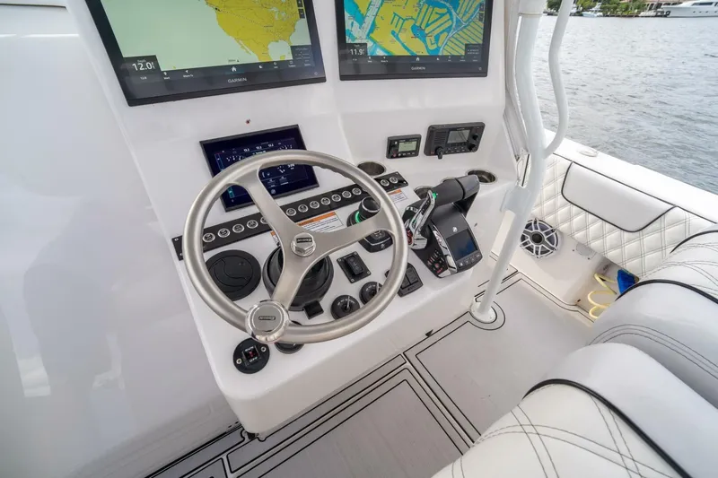 Atlas Yacht Photos Pics 2023 Contender 39 Fisharound boat helm with advanced navigation displays and controls.