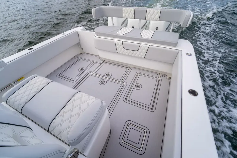 Atlas Yacht Photos Pics 2023 Contender 39 Fisharound boat interior with cushioned seating and stylish deck design.