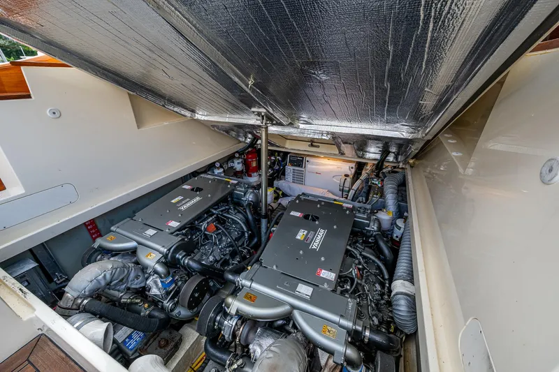 Miss Behave Yacht Photos Pics Engine room of 2017 Hinckley Picnic Boat 37 MKIII, showcasing dual engines and mechanical components.