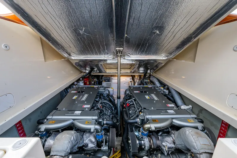 Miss Behave Yacht Photos Pics Engine compartment of a 2017 Hinckley Picnic Boat 37 MKIII, showcasing dual engines.