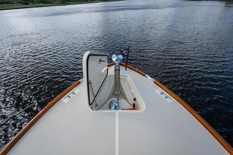 Miss Behave Yacht Photos Pics Hinckley Picnic Boat 37 MKIII 2017 bow view on calm water.