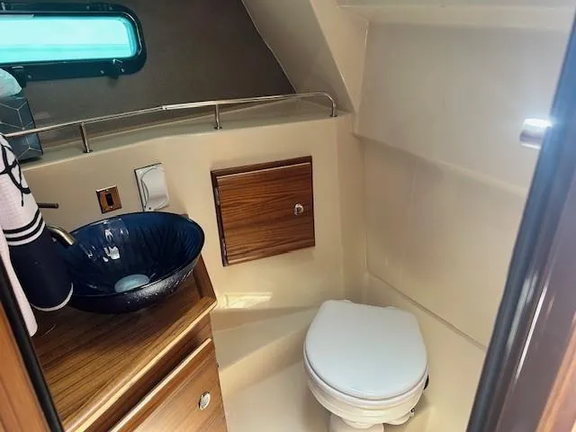  Yacht Photos Pics 2024 Ranger Luxury Edition yacht bathroom with modern sink and toilet.