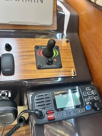  Yacht Photos Pics Control panel of 2024 Ranger Luxury Edition boat with thruster joystick and communication radio.