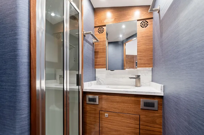 New Viking 46 Billfish Yacht Photos Pics Luxurious bathroom interior of 2026 Viking 46 Billfish yacht with modern fixtures and wood accents.