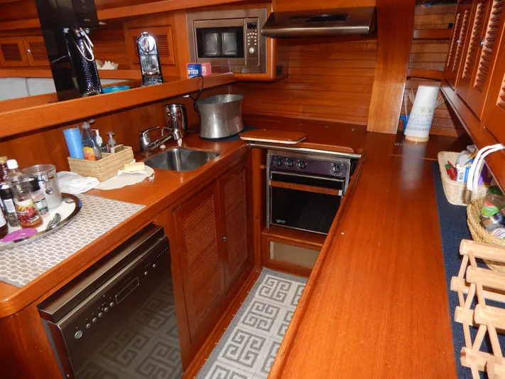 Deep Blue Yacht Photos Pics 2002 Northwind sailing yacht kitchen with wooden cabinetry.