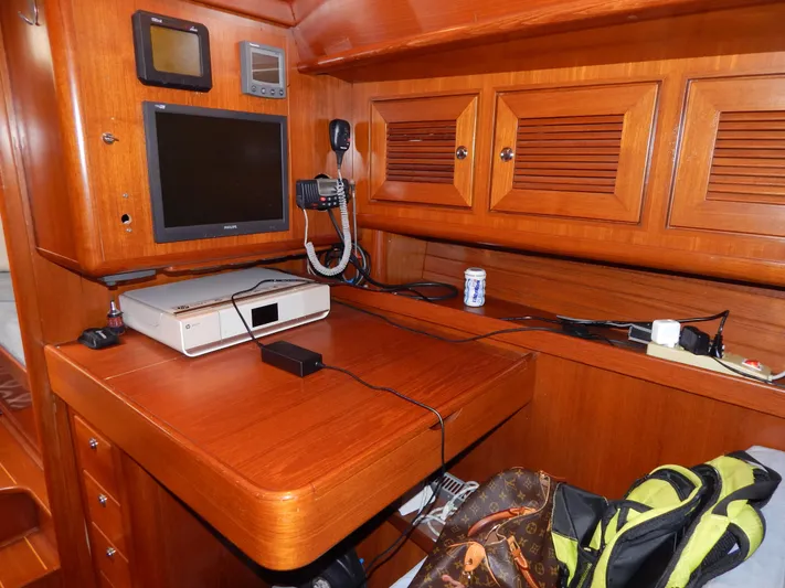 Deep Blue Yacht Photos Pics Interior of a Northwind sailing yacht with wooden cabinetry and electronics.