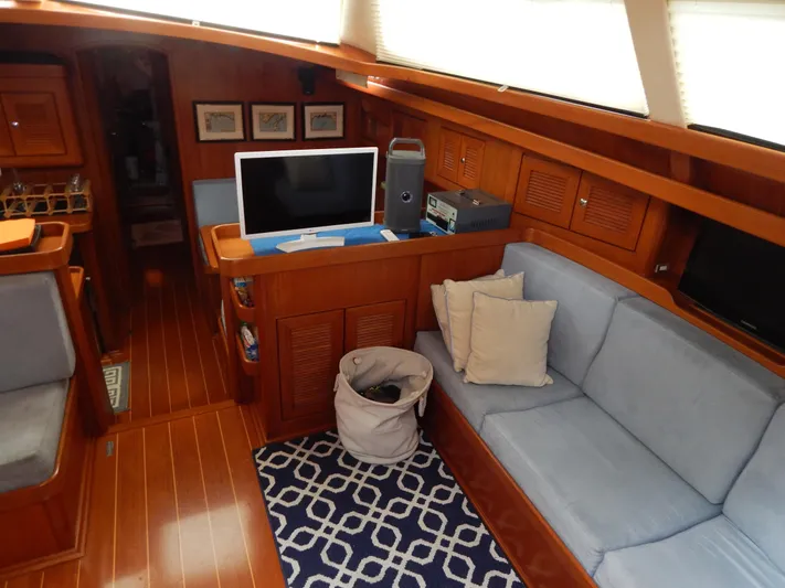 Deep Blue Yacht Photos Pics Interior of a 2002 Northwind sailing yacht with cozy sofa.