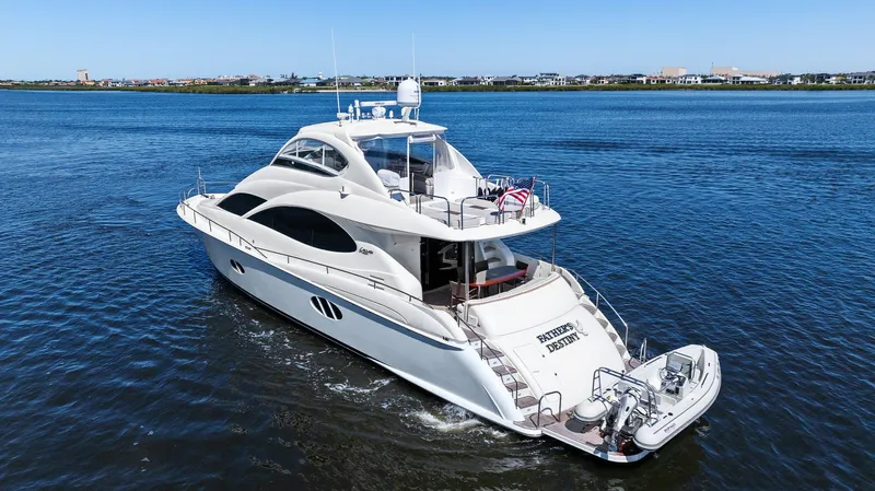  Yacht Photos Pics 2005 Lazzara 68 Pilothouse Motoryacht cruising on open water, showcasing sleek design and luxury.